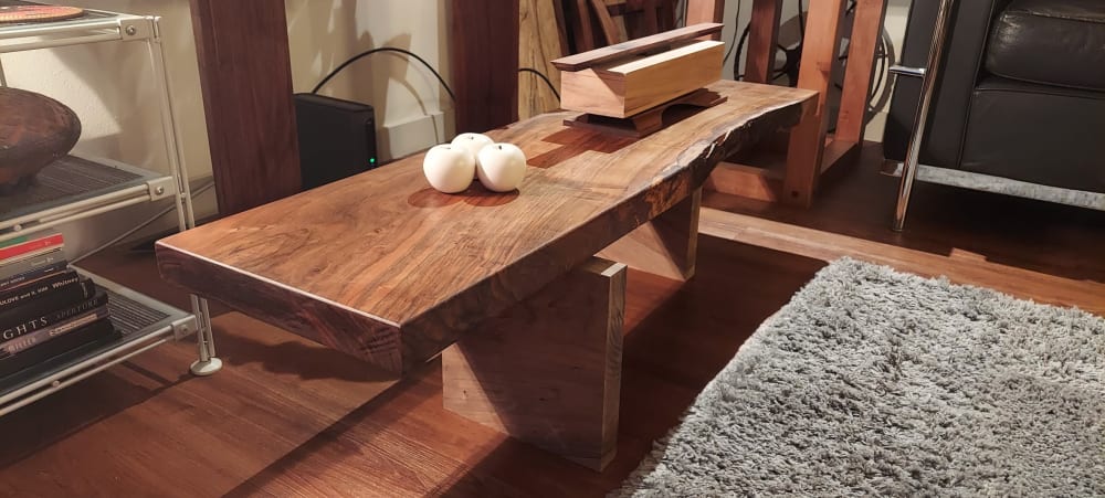 Small Japanese style slab coffee table.  Bastogne Walnut | Tables by SjK Design Studios