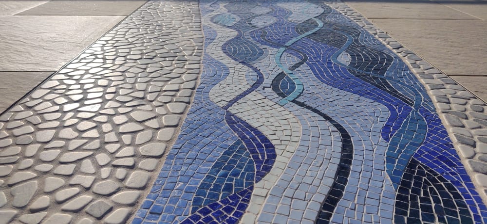 Mosaic patio inlay suggesting a river | Public Mosaics by JK Mosaic, LLC