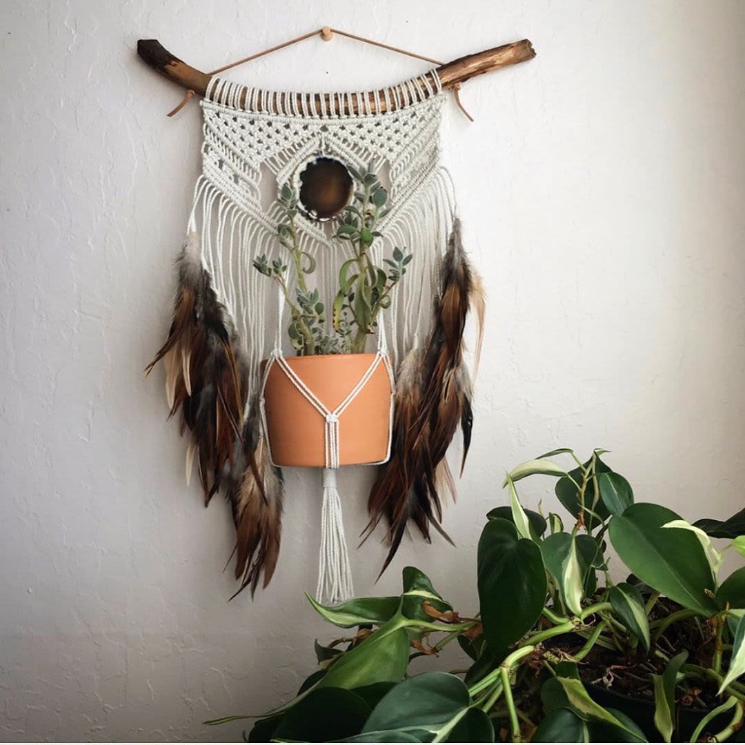 Macrame plant hanger with feathers 