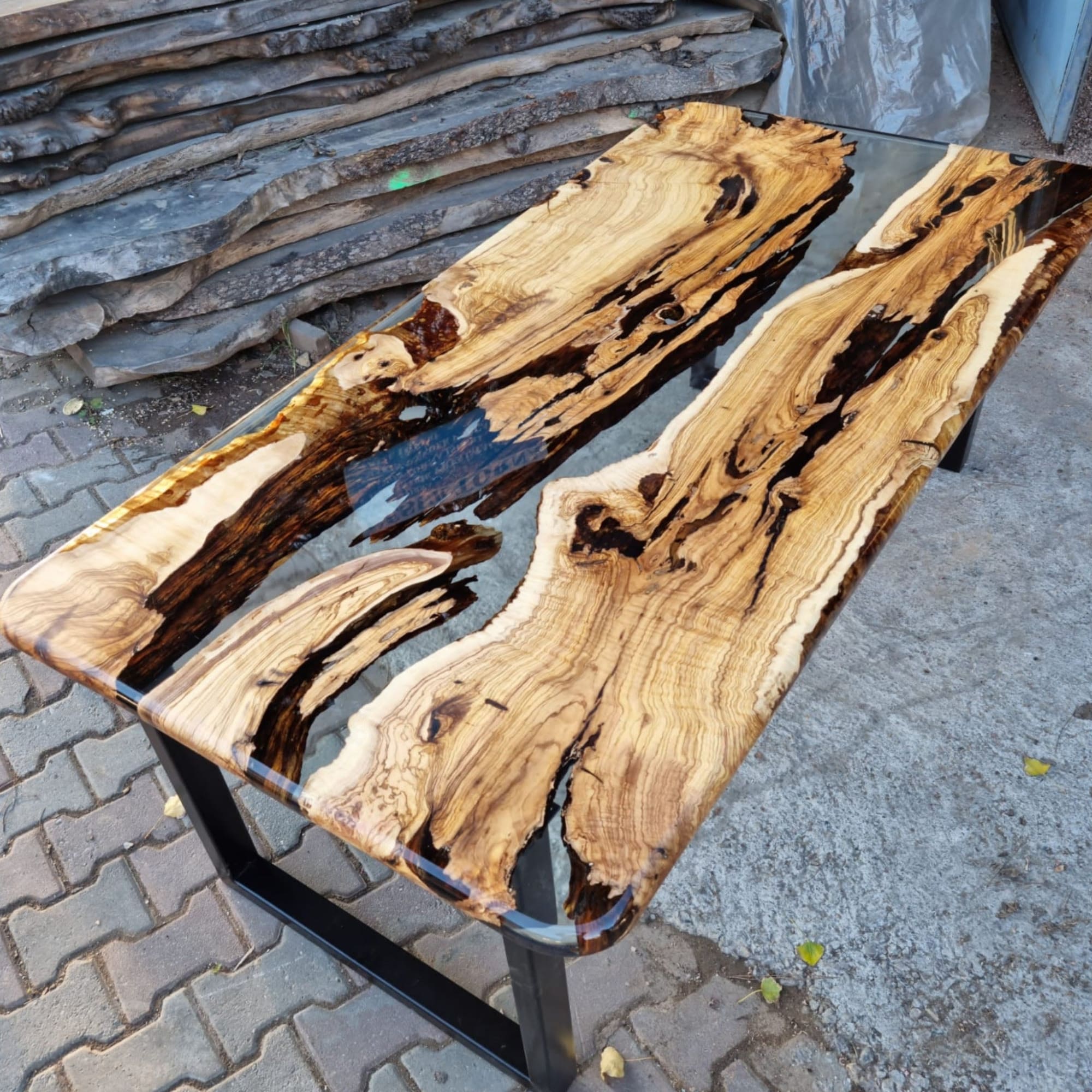 Live edge Clear Epoxy Table made from olive wood by Ironscustomwood