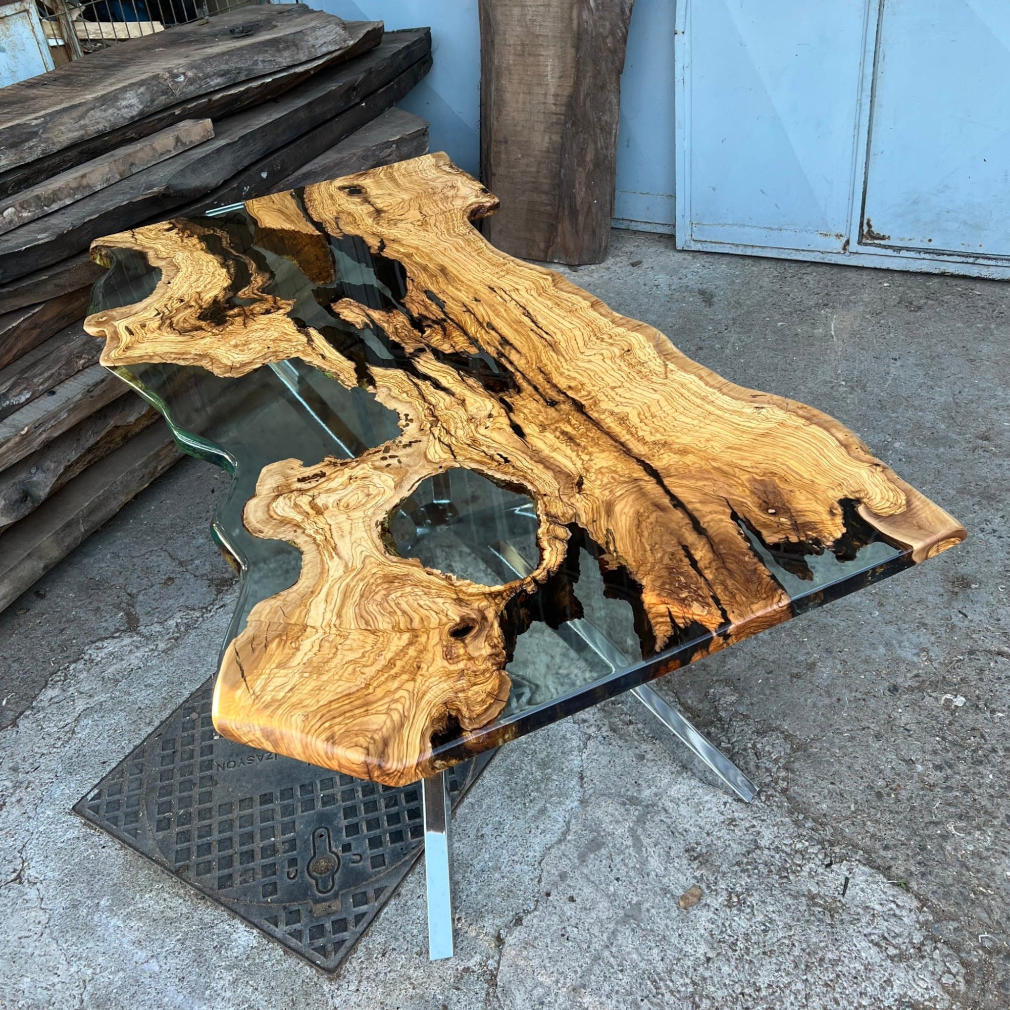 Live edge Clear Epoxy Table made from olive wood by Ironscustomwood