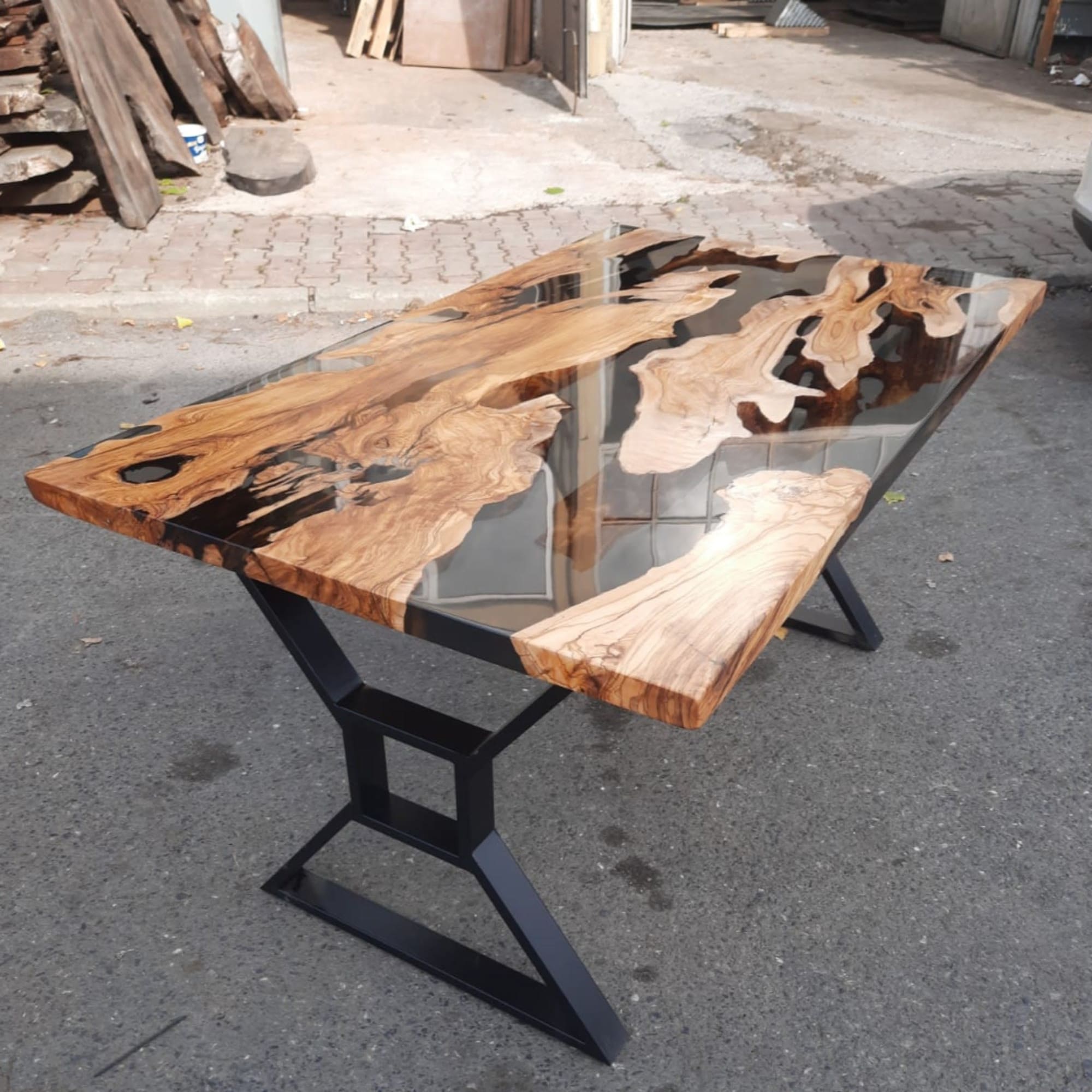 Live edge Clear Epoxy Table made from olive wood by Ironscustomwood
