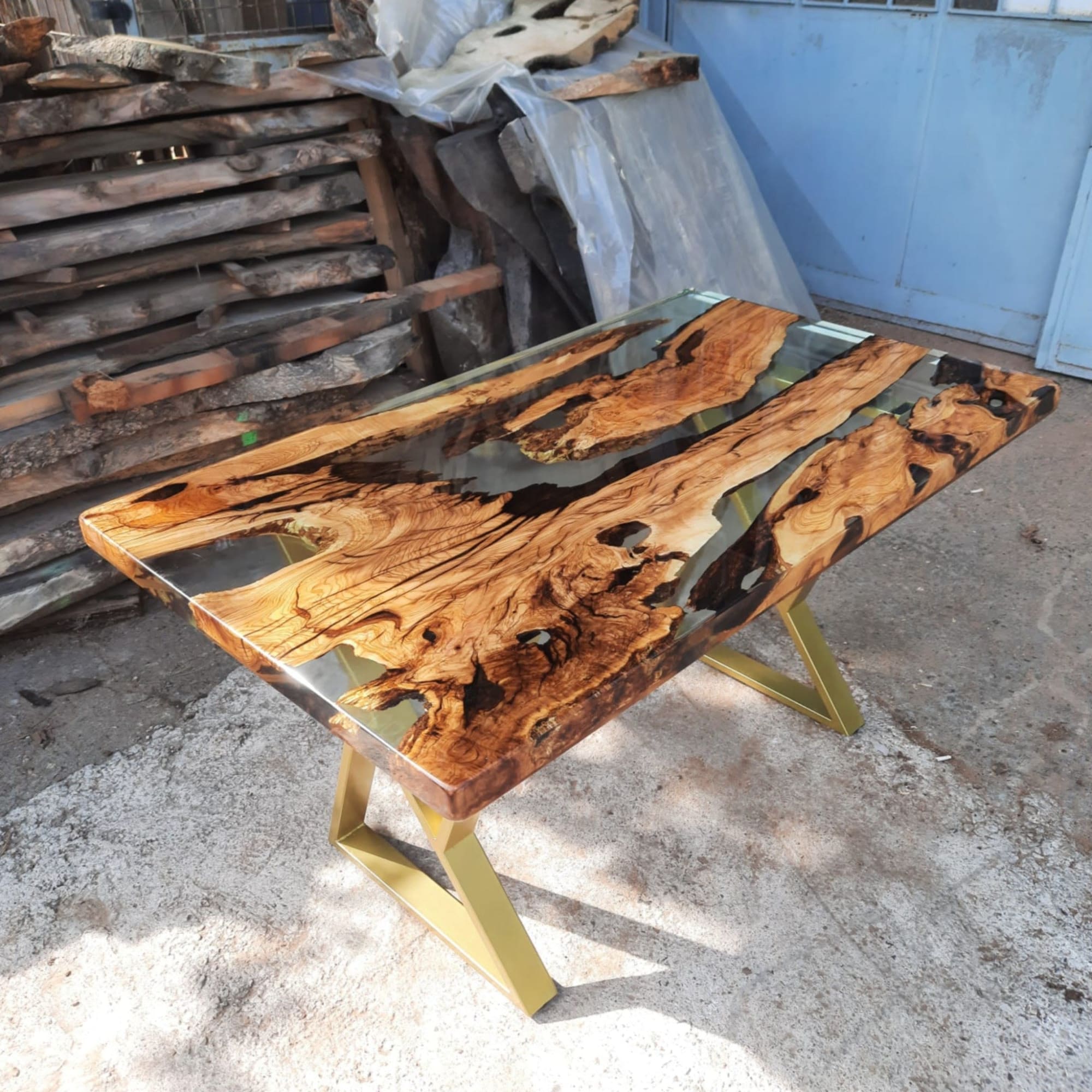 Live edge Clear Epoxy Table made from olive wood by Ironscustomwood