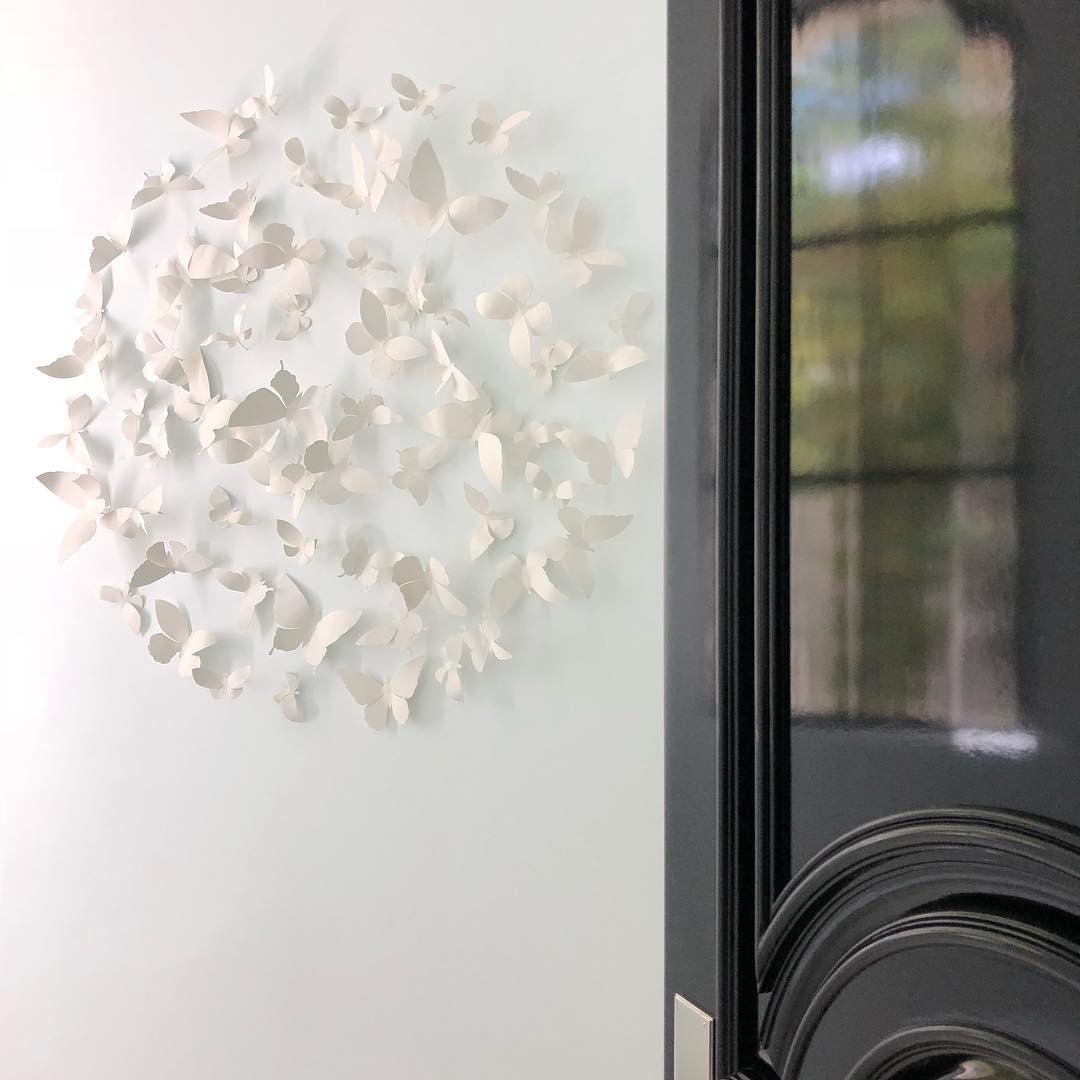 Delicate white circular butterfly wall decor 