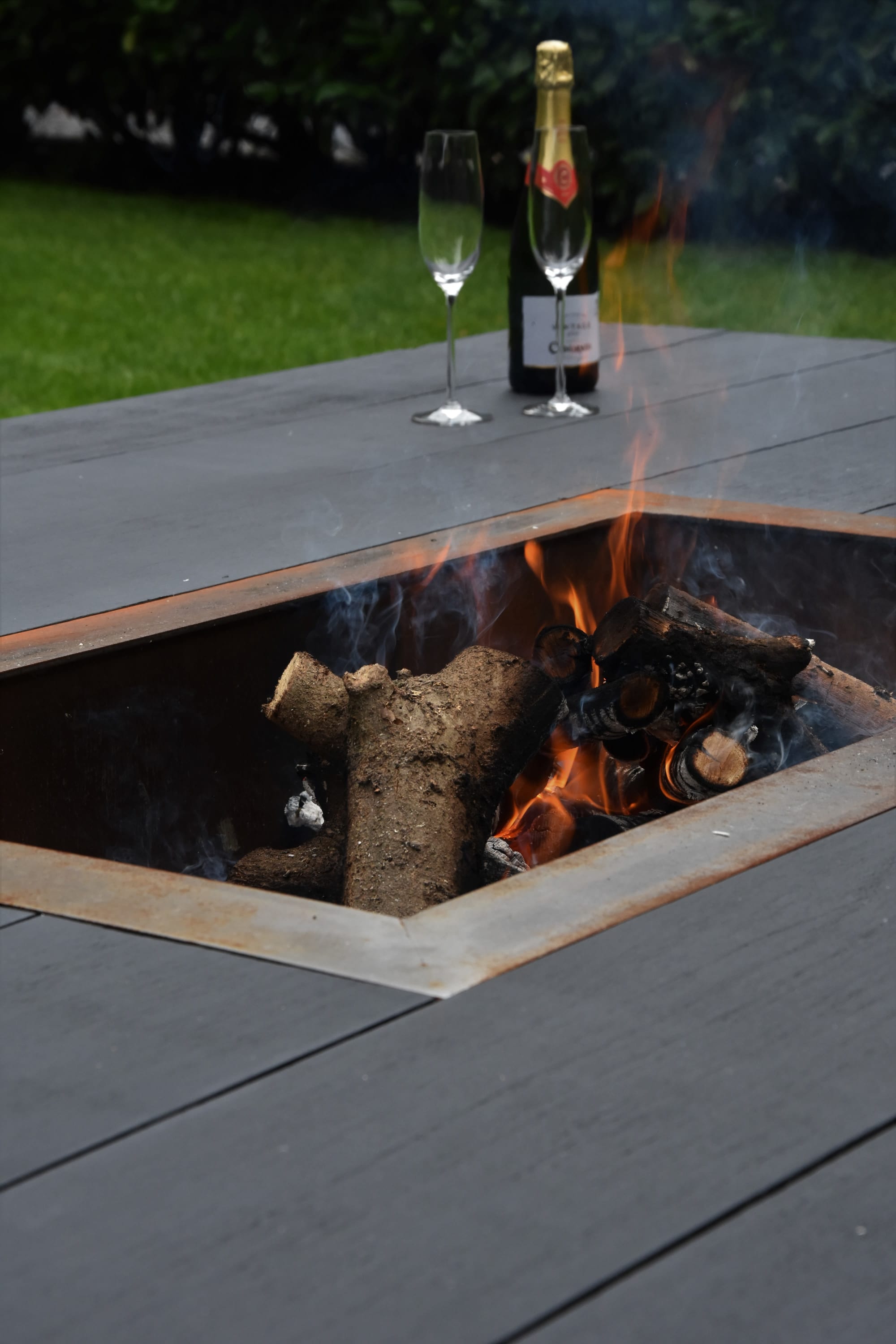 glass fire table on Low Xxl Outdoor Table With Open Fire Pit By Craft B Seen At Private Residence Brecht Wescover