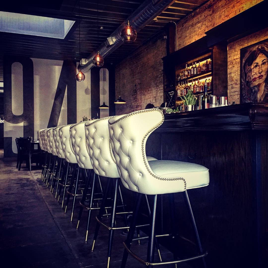 white button tufted winged nail head trimmed bar stool