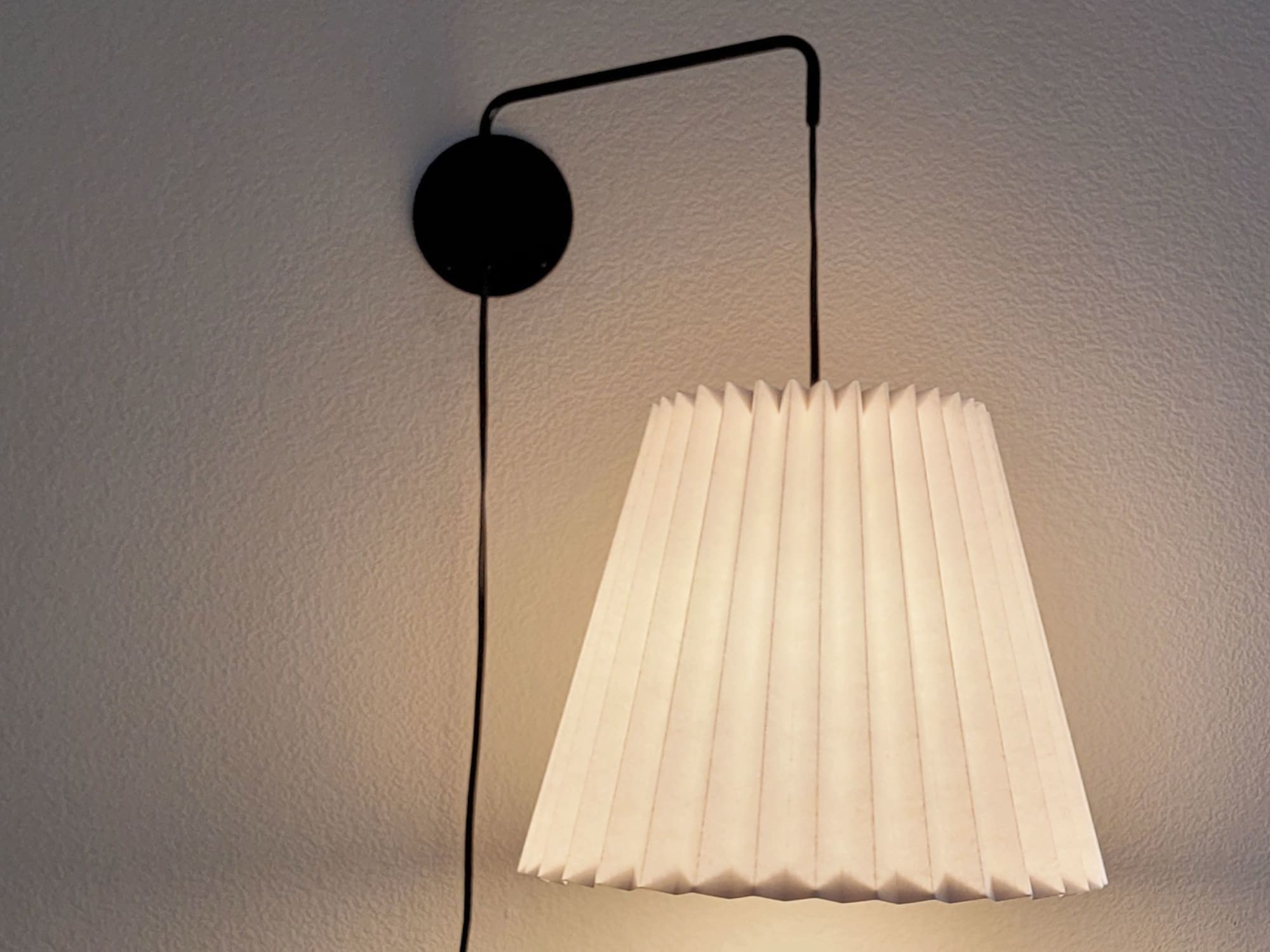 Industrial sconce with pleated empire lampshade by Studio Pleat