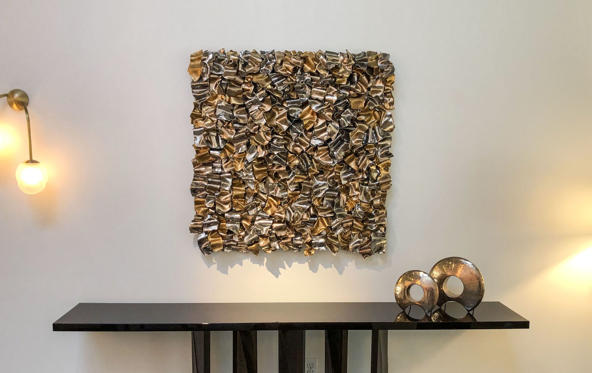 gold metal ribbon wall art sculpture