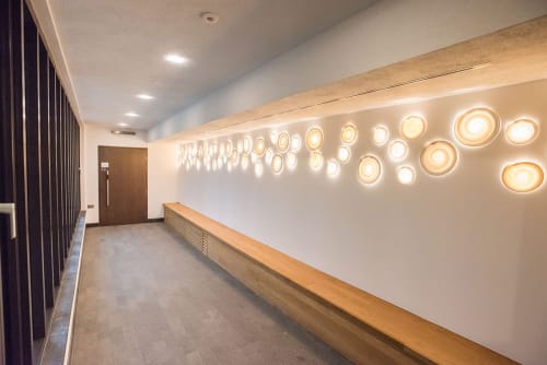 Space Discs - porcelain lit wall installation | Lighting by Margaret O'Rorke | Wolfson College in Oxford