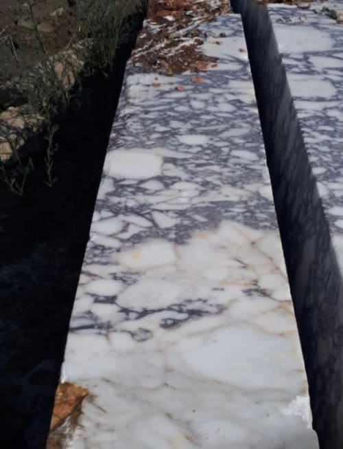 Calacatta Viola Marble Sink: Hand Carved Wall Mount Washbasin | Water Fixtures by AEGEAN MARBLE ARTISAN ATELIER