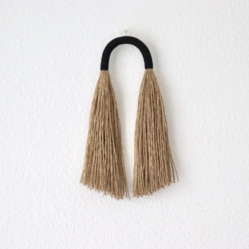 Small Jute Tassel with black arch | Wall Hangings by YASHI DESIGNS by Bharti Trivedi