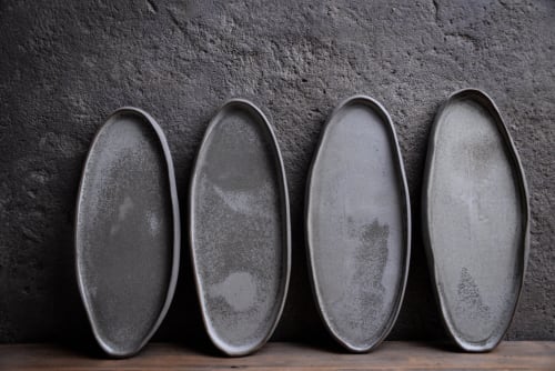 Organic natural shape elongated stoneware plates in grey | Dinnerware by Laima Ceramics