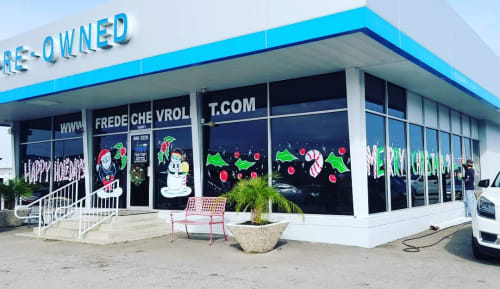 Holiday Window Painting | Art & Wall Decor by PaintSlingers | Norman Frede Chevrolet in Houston