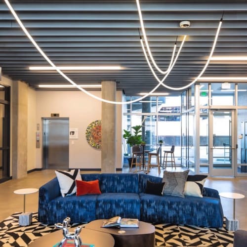 Tracer Loop | Chandeliers by Luke Lamp Co. | RiDE Apartments in Denver