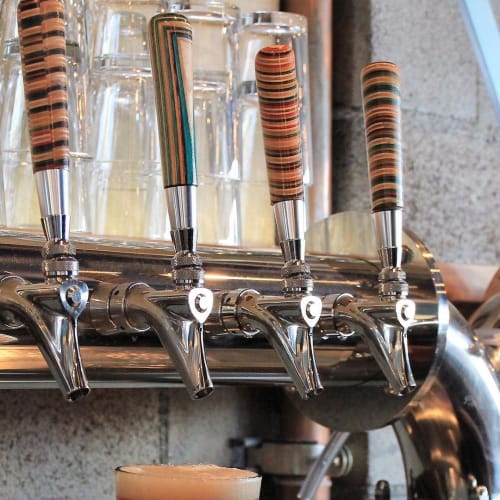 Recycled Skateboard Tap Handles | Furniture by Iris Skateboards | HopSaint Brewing Company in Torrance