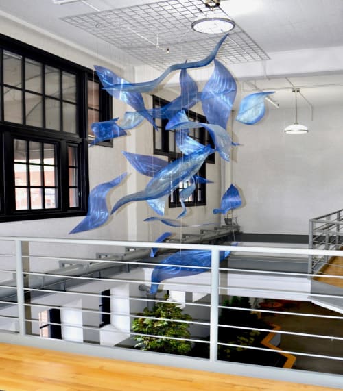 Waves of Blue, Aerial suspended metal sculpture | Art & Wall Decor by Bonnie Rubinstein Glass Studio | Allen Building in Saint Paul
