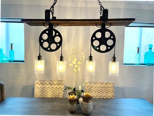 Barnwood 4 light chandelier with dual cast iron pulleys | Chandeliers by Lakehouse Lighting