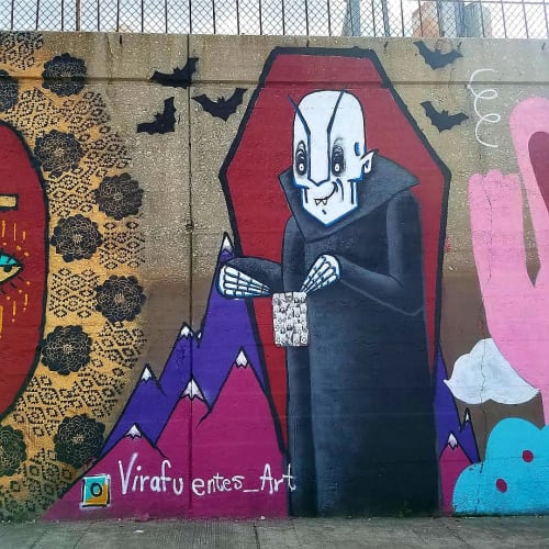 Nosferatu holding sign with Stickers | Street Murals by Natalia Virafuentes