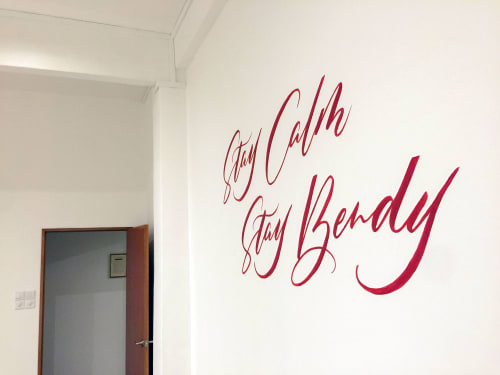“Stay Calm Stay Bendy” Calligraphy Wall Mural | Murals by Leah Chong | Kate Porter Yoga River Valley in Singapore