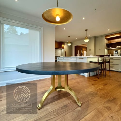 Charcoal walnut brass tripod wishbone table | Dining Table in Tables by YJ Interiors