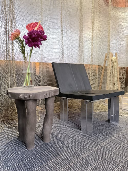 Organic hand sculpted table in black ceramic | Tables by Ingrid Vermulst by Studio Wild Orange | CASA DECOR 2026 in Madrid