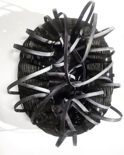 Woven rattan sculpture with rubber | Wall Sculpture in Wall Hangings by Charlotte Blake