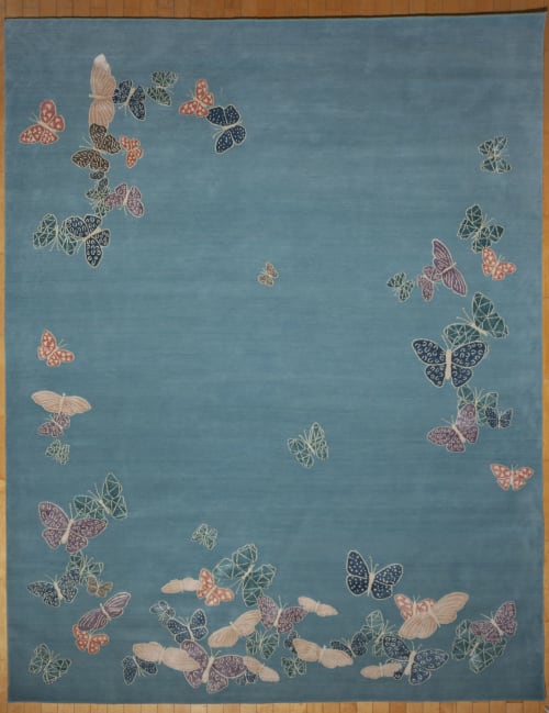 Spirit in the sky. Blue background rug with butterflies | Area Rug in Rugs by Sergio Mannino Studio