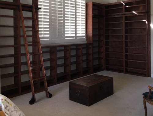 Custom Library Wall Unit with 2 Rolling Ladders Made with Walnut | Furniture by Larry St. John & Co. Custom Furniture