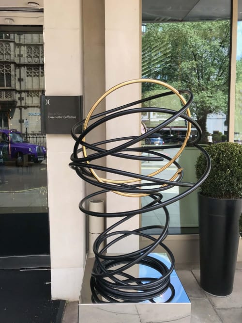 Gold in Black Tall Spiral | Public Sculptures by Mark Beattie MRSS | 45 Park Lane in London