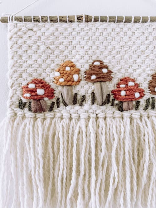 Wool felt mushroom wall hanging in a 4 inch embroidery hoop