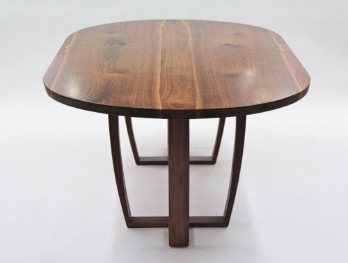 Oval walnut table, Trapeze leg, with book-matched top. | Tables by Jonathan Field