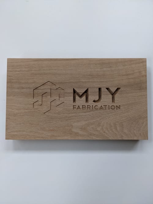 Custom engraving in solid wood | Signage by MJY Fabrication