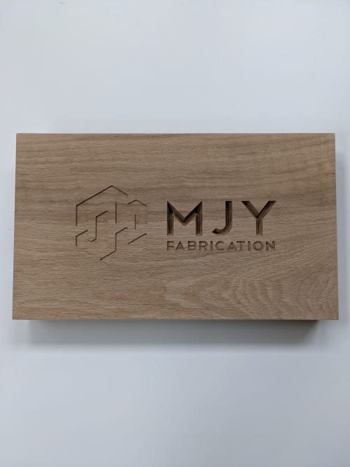 Custom engraving in solid wood | Signage by MJY Fabrication