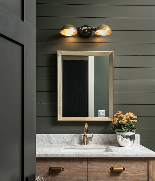 Industrial adjustable double brass and black wall sconce light | Lighting Design by DLdesignworks LLC | Private Residence in Naperville