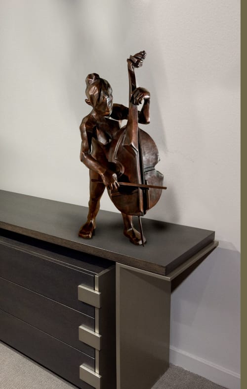 Woman musician playing the bass | Sculptures by Dina Angel-Wing | Berkeley, CA in Berkeley