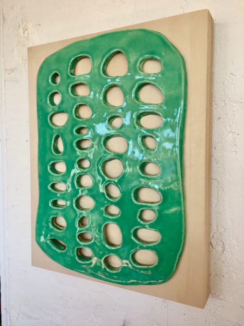 Green ceramic sculpture on wood panel | Wall Hangings by Kelly Witmer
