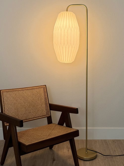 Gold floor lamp with a pleated oval long lampshade | Lamps by Studio Pleat