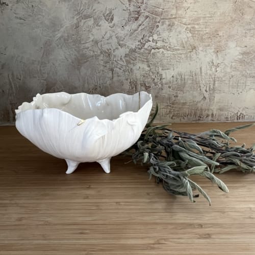 Porcelain and gold translucent white bowl on feet