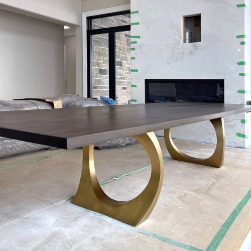Charcoal walnut brass halo dining table | Tables by YJ Interiors