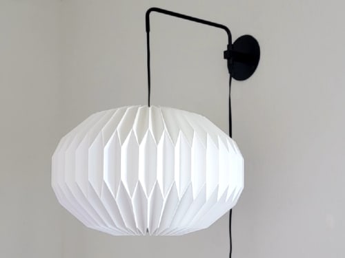 Industrial sconce with pleated elliptical lampshade | Sconces by Studio Pleat