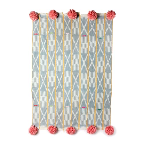 baoule pom pom throw cream micro stripe/peony poms | Blanket in Linens & Bedding by Charlie Sprout