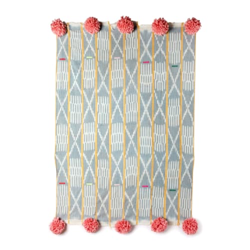 baoule pom pom throw cream micro stripe/peony poms | Linens & Bedding by Charlie Sprout