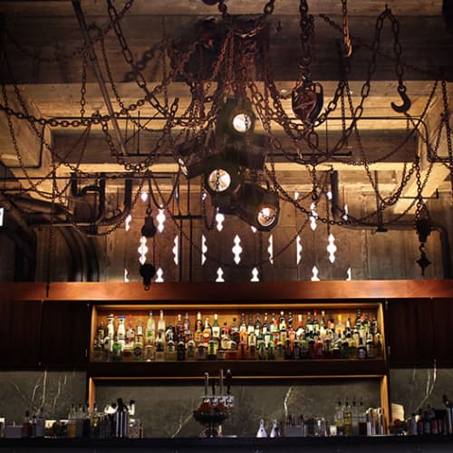 Rusted-Metal Chains And Lighting Fixtures | Lighting by Michael Schmidt | Ace Hotel LA in Los Angeles