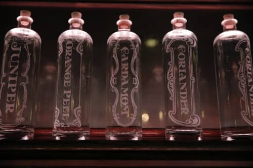 Etched distillate bottles | Tableware by Reclamation Etchworks | Whitechapel in San Francisco