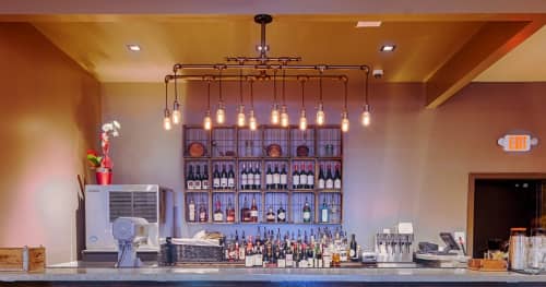 12 Light Pipe Chandelier | Chandeliers by Hammers and Heels | Mason Social in Alexandria