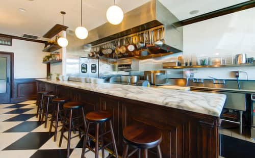 Carrera Marble-topped Wood Bar | Tables by Estee Stanley | Petit Trois in Los Angeles