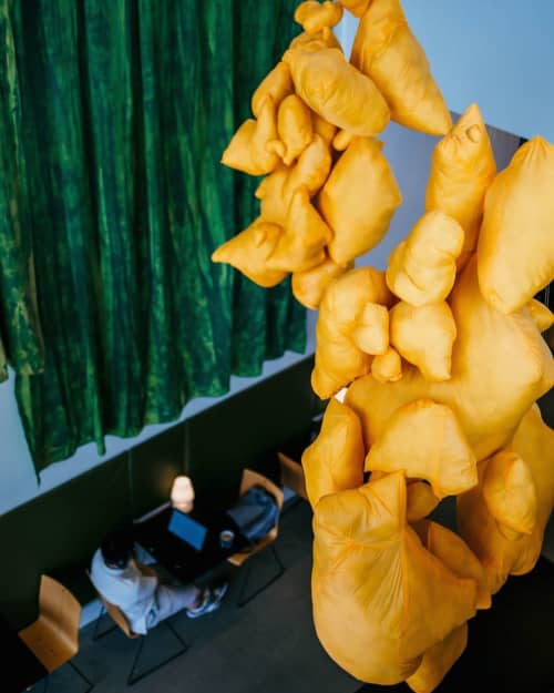 Mustard-colored soft sculpture | Sculptures by Lily Erb | Mudhouse Coffee 10th Street in Charlottesville