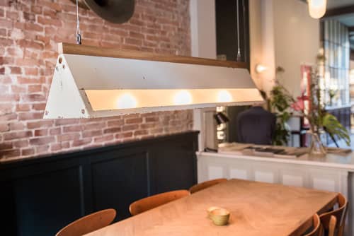 White Dolphin | Pendants by Blom & Blom | Roebling's in Amsterdam. Item composed of steel and ceramic