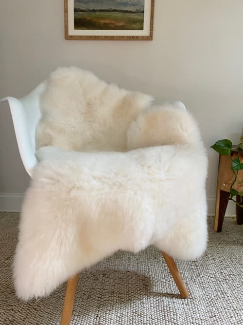 Bright Ivory Nursery Sheepskin | Small Rug in Rugs by East Perry. Item composed of fabric