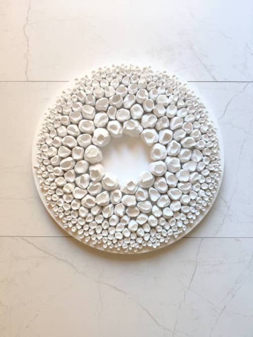 White wall sculpture on a 14" round canvas, wreath art | Wall Hangings by Natasha Kanevski. Item composed of wood & fabric compatible with minimalism and contemporary style